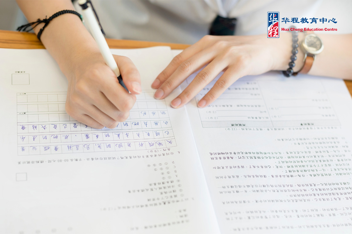 Female Student Writing Chinese Exam